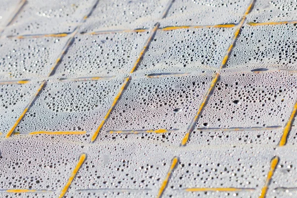 Gotas de água na superfície plástica transparente — Fotografia de Stock