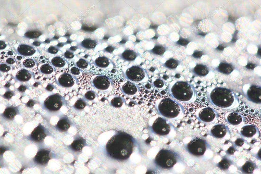 Water drops on transparent plastic surface