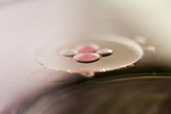 Composition of oil drops on a water surface — Stock Photo, Image