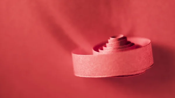 Red paper spiral on paper background — Stock Photo, Image