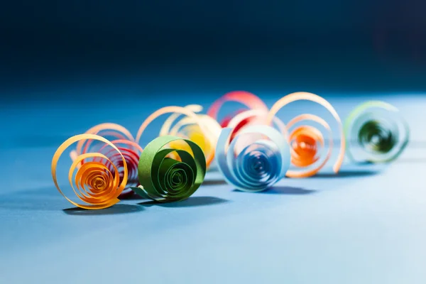 Macro, abstract, background picture of colored paper spirals on paper background — Stock Photo, Image