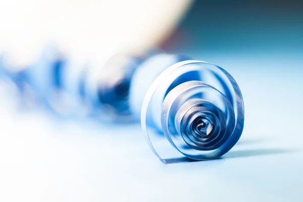 Macro, abstract, background picture of blue paper spirals on paper background — Stock Photo, Image