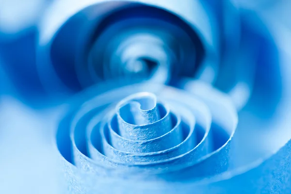 Macro, abstracte, achtergrondafbeelding van blauw papier spiralen op papier achtergrond — Stockfoto