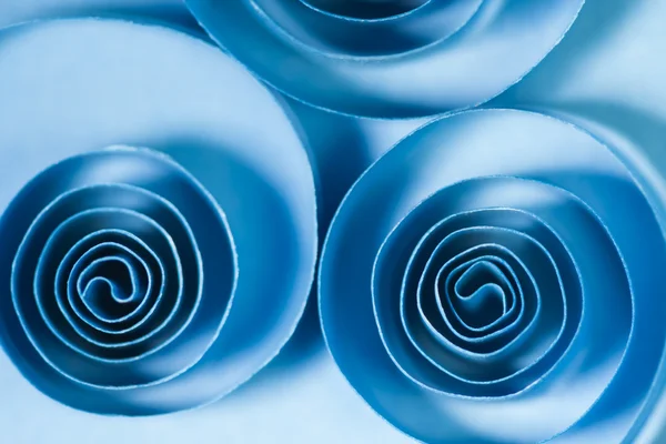 Macro, abstract, background picture of blue paper spirals on paper background — Stock Photo, Image