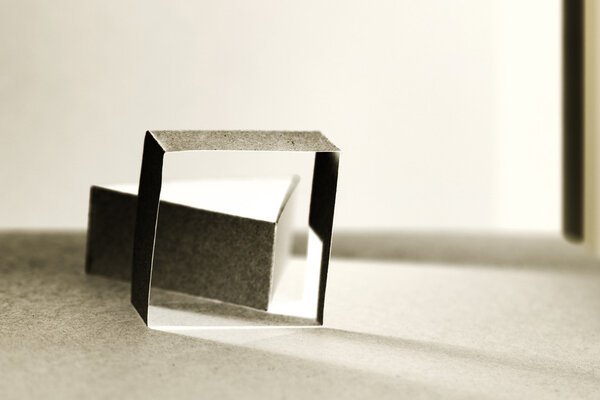 Colorful paper shapes with paper background