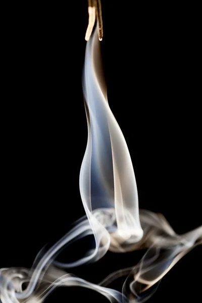 Smoke shapes on black background — Stock Photo, Image