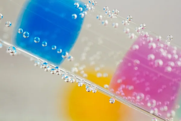 Tube with jelly balls — Stock Photo, Image