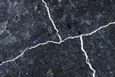 Abstract composition with cracked soil and inverted colors clipart