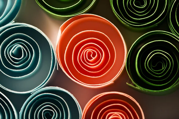 Macro, abstract, background picture of colored paper spirals on paper background — Stock Photo, Image