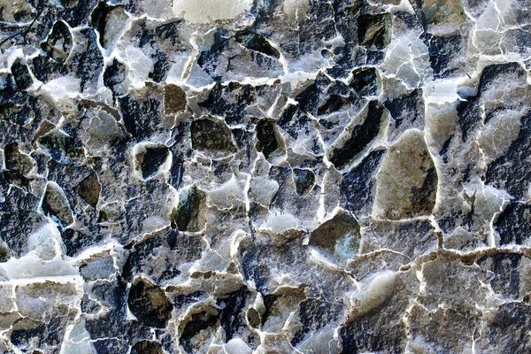 Old wall texture with peeled mortar and the materials inside with inverted colors — Stock Photo, Image