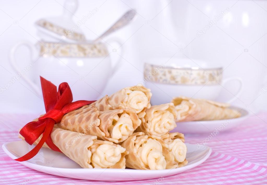 Wafer rolls with cream tied with red ribbon