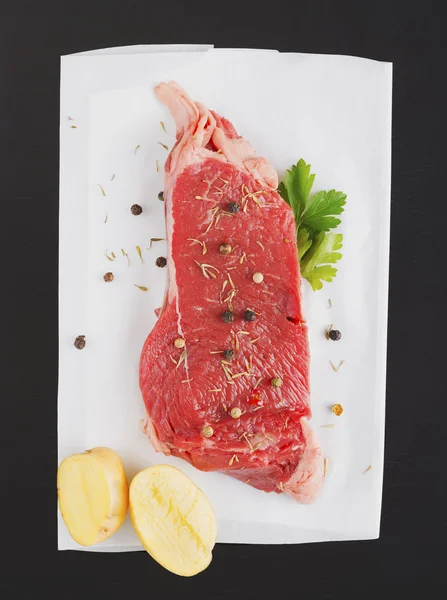 Raw steak on a plate — Stock Photo, Image