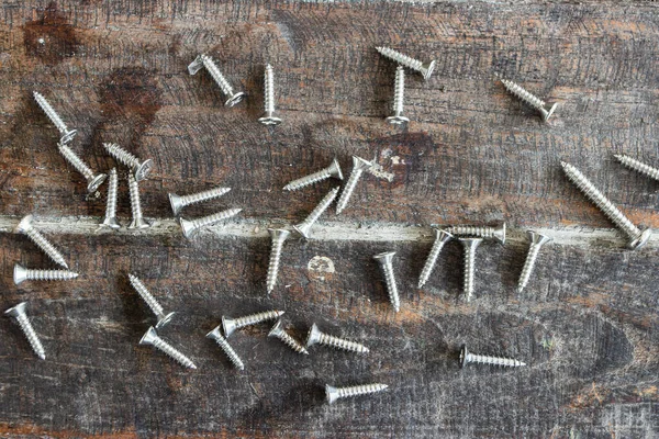 Lot Screws Wooden Background — Stock Photo, Image