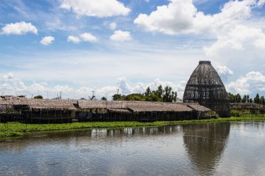 The biggest coop made from the bamboo structure is a trap for catching fish at Saphanburi Arch bridge local Market, Thailand.