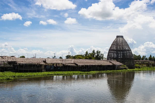 The biggest coop made from the bamboo structure is a trap for catching fish at Saphanburi Arch bridge local Market, Thailand.
