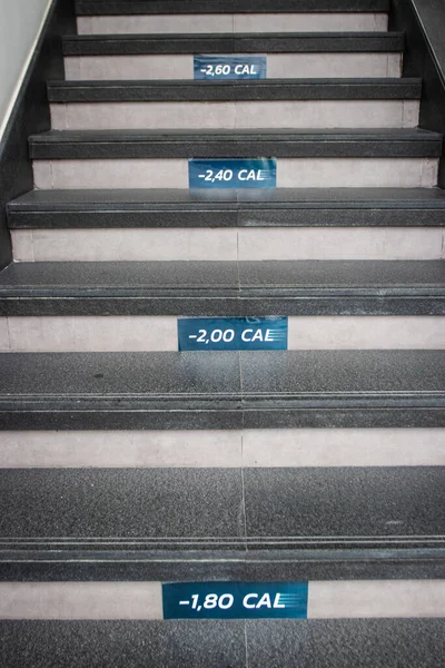 The number of calories counting on stairs. Concept of steps moving for physical activity.