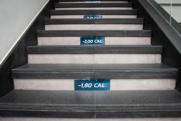 The number of calories counting on stairs. Concept of steps moving for physical activity.