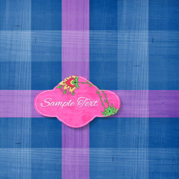 Цветные квадратные текстуры ткани фон с бумажной цветочной этикеткой
