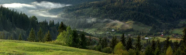 Panorama of the Carpathian mountains on a foggy morning