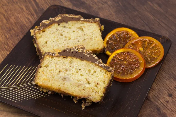 Two slices of banana cake on the wooden plate — Stock Photo, Image