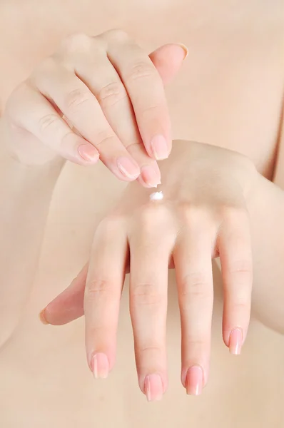 Woman applying cream — Stock Photo, Image