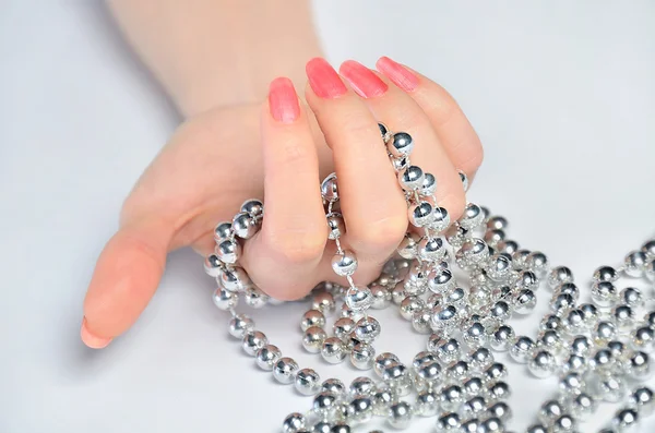 Hand with beads — Stock Photo, Image