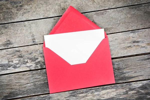 Blank White Paper Placed Open Red Paper Envelope Top View — Stock Photo, Image