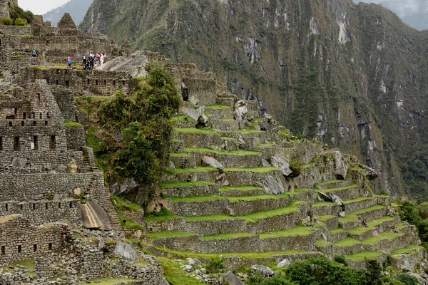 MACHU PICCHU, PERU - MARCH 9, 2019: Cascading agricultural terraces of incas ancient city at Machu Picchu — Stock Photo, Image