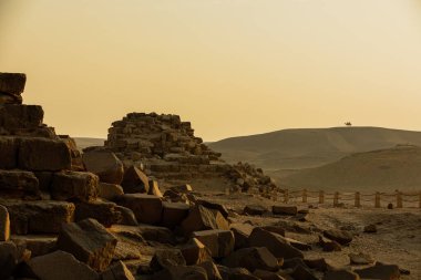 Limestone and granite blocks next to the Great Pyramid in Giza, Egypt