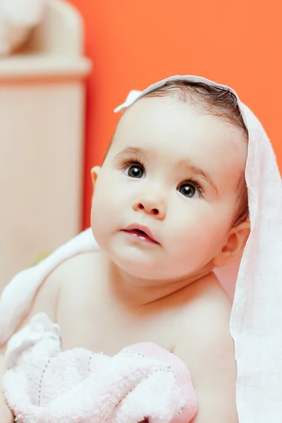 Adorable baby, looking out under a white blanket — Stock Photo, Image