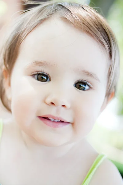 Cute little girl with big brown eyes. — Stock Photo, Image