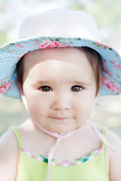 Cute little girl with a little cap. — Stock Photo, Image