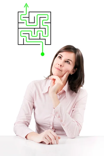 Businesswoman solving labyrinth problem. — Stock Photo, Image