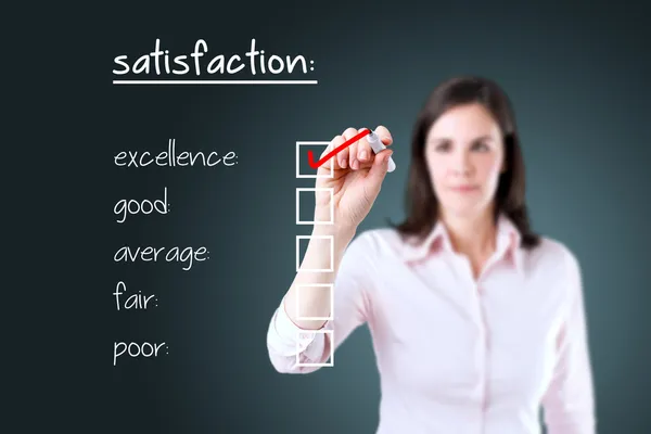 Young business woman checking excellence on customer satisfaction survey form. — Stock Photo, Image