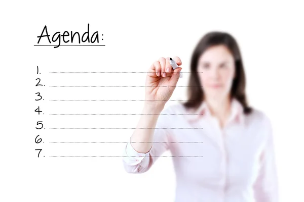 Jovem mulher de negócios escrevendo lista agenda em branco, fundo branco . — Fotografia de Stock