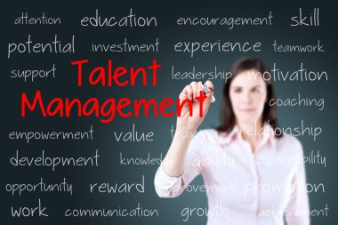 Business woman writing talent management concept. Blue background. clipart