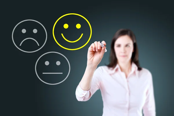 Mujer de negocios seleccionar feliz en la evaluación de la satisfacción. Fondo azul . —  Fotos de Stock