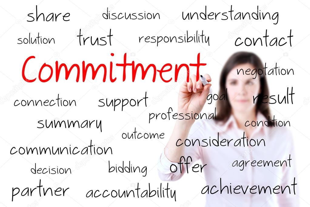 Young business woman writing commitment concept. Isolated on white.