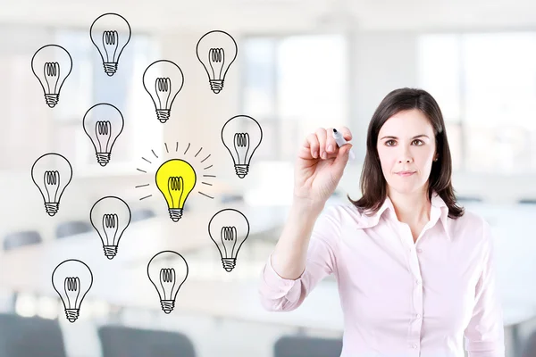 Business woman drawing a great idea concept. Office background. — Stock Photo, Image
