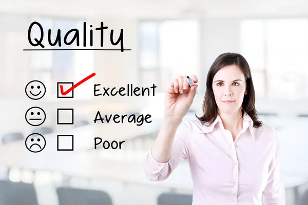 Hand putting check mark with red marker on excellent quality evaluation form. Office background. — Stock Photo, Image