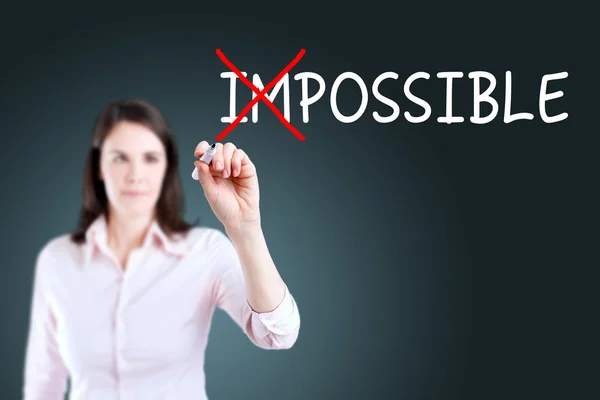 Businesswoman choosing Possible instead of Impossible. Blue background. — Stock Photo, Image