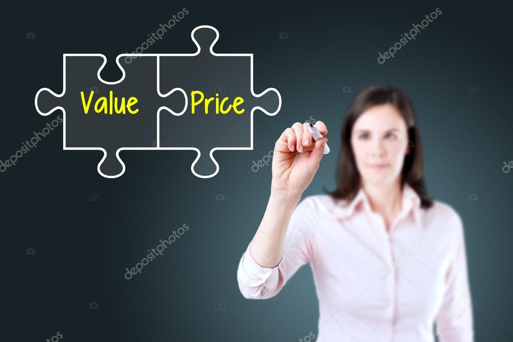 Businesswoman drawing a Value Price puzzle concept on the virtual screen. Blue background.