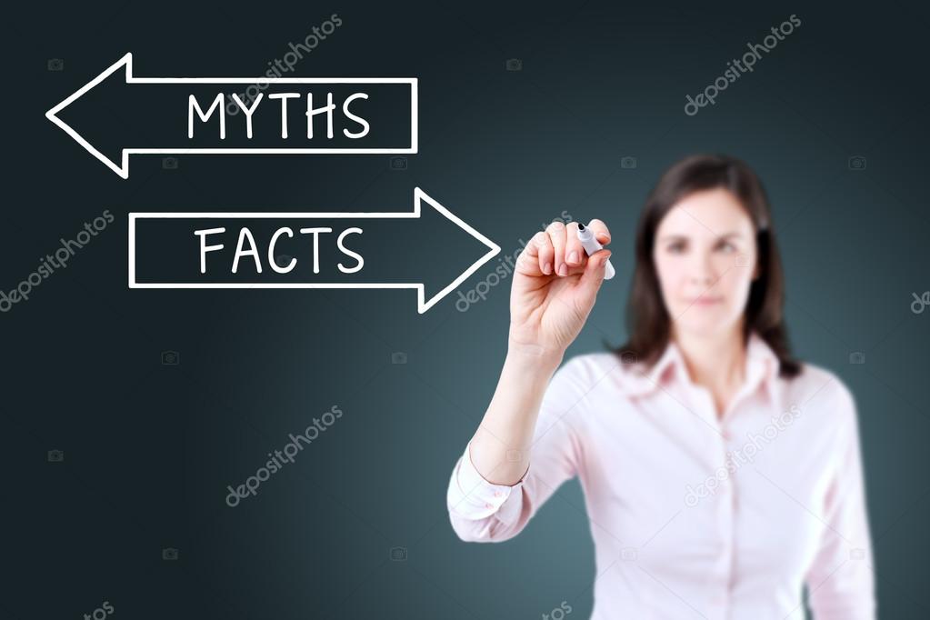 Businesswoman drawing a Myths or Facts concept on the virtual screen. Blue background.