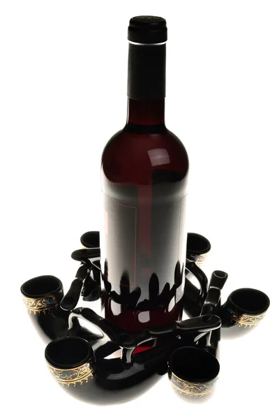 Still life of bottles of wine and drinking horns — Stock Photo, Image