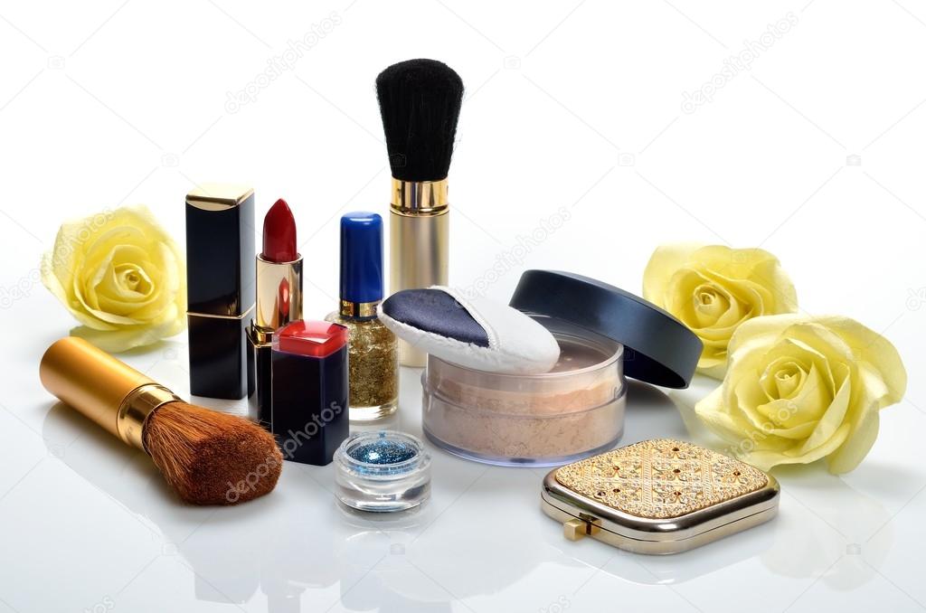 Items for decorative cosmetics, makeup, mirror and flowers