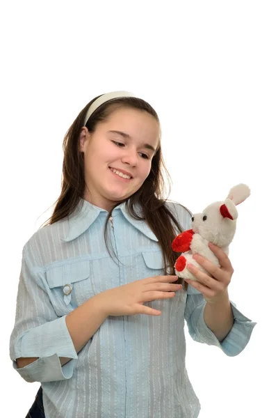 Teen girl holds favorite toy hare — Stock Photo, Image