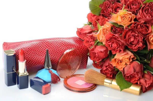 Items woman are used makeup and cosmetics, cosmetic bag and a bouquet of roses — Stock Photo, Image