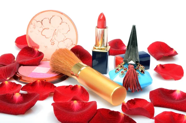 Scarlet rose petals and women's decorative cosmetics, perfume in still life — Stock Photo, Image