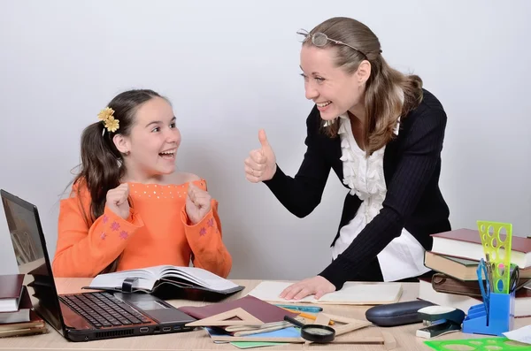 Teenage schoolgirl rejoices a good assessment from the teacher — Stock Photo, Image