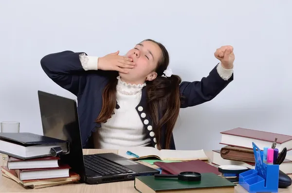 Schoolgirl yawns, wants to sleep during the lesson boring — Stock Photo, Image